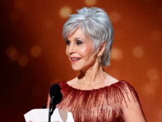 Jane Fonda gives a thumbs up while receiving COVID-19 vaccine